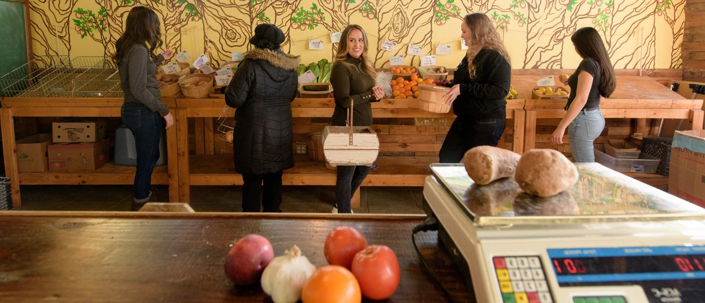 Women shopping at a farmer's market.